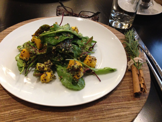 Bowls of spirulina, hemp seeds, moringa, nori and bee pollen arranged on a neutral kitchen surface