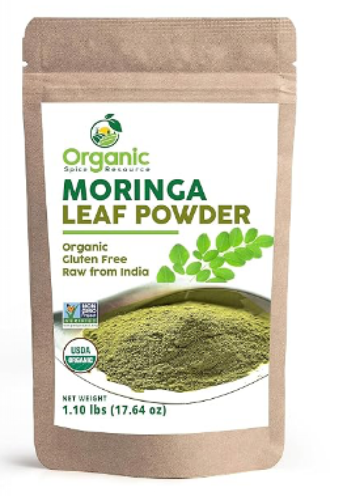 Fresh moringa leaves and moringa powder in a Jamaican kitchen setting